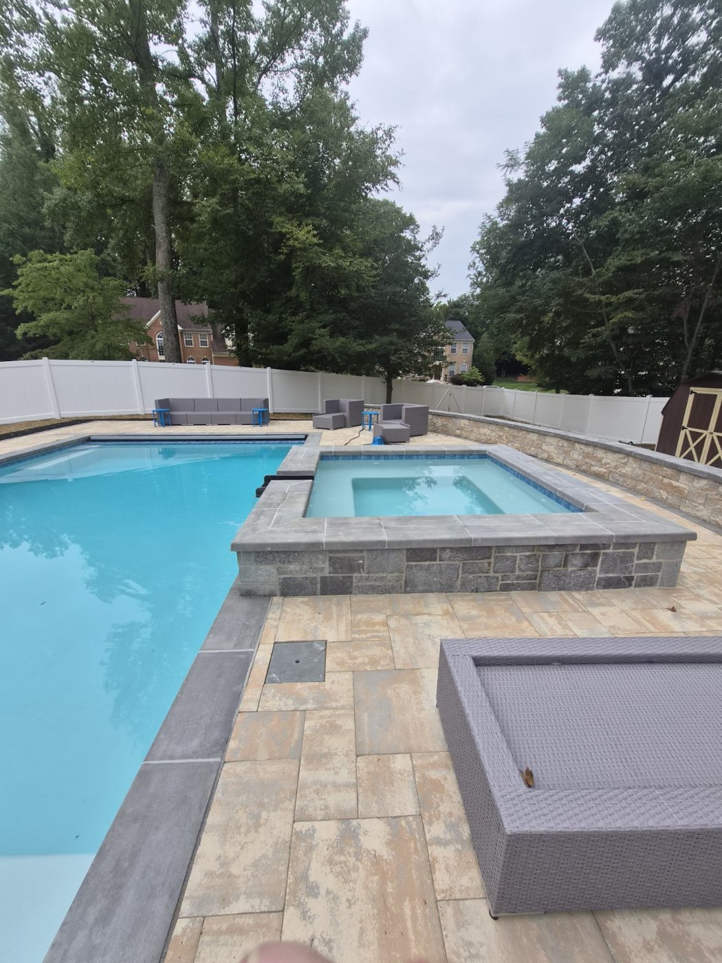 Pool with raised spa and stone decking
