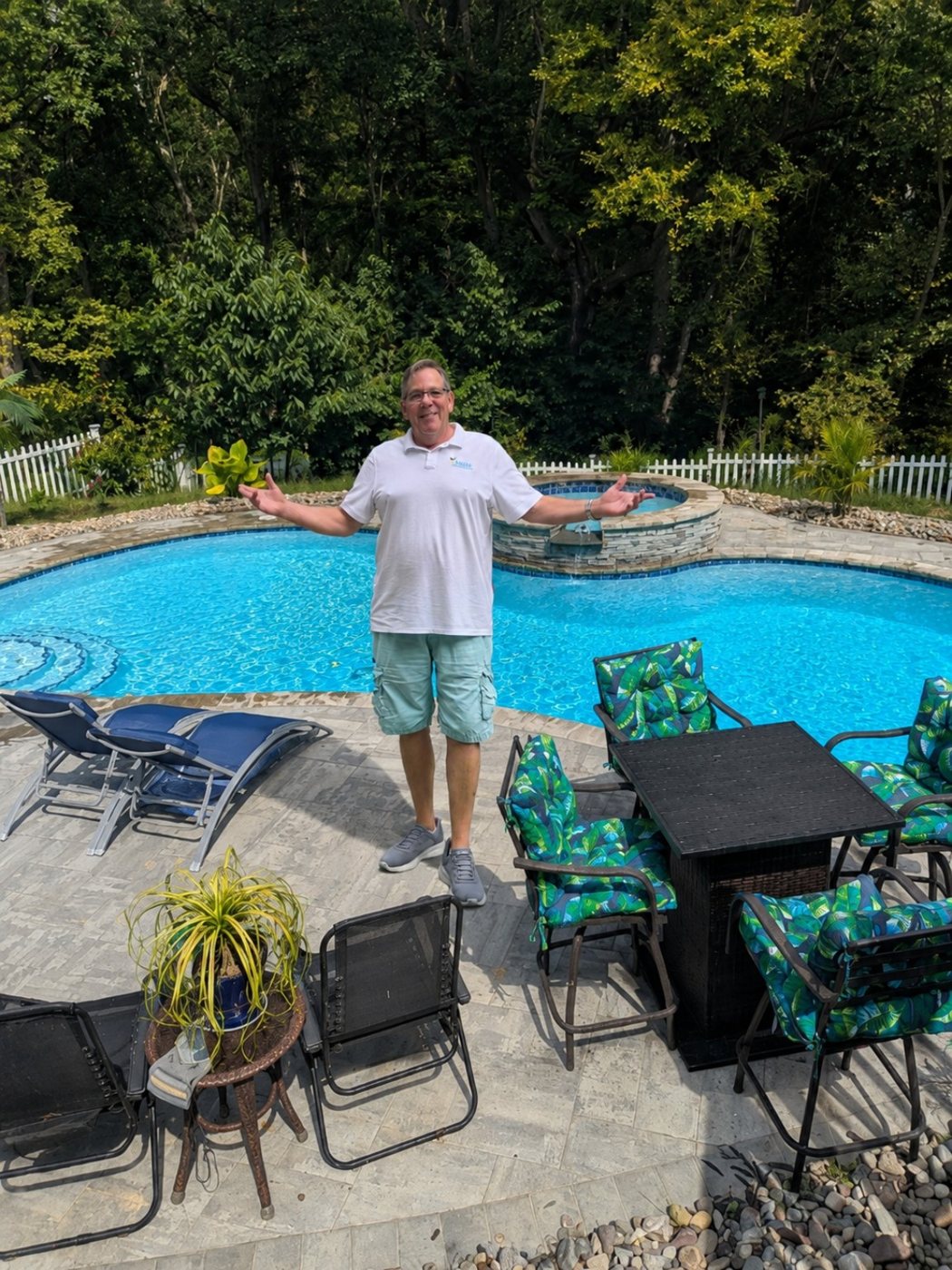 David Owen beside a custom pool and raised spa