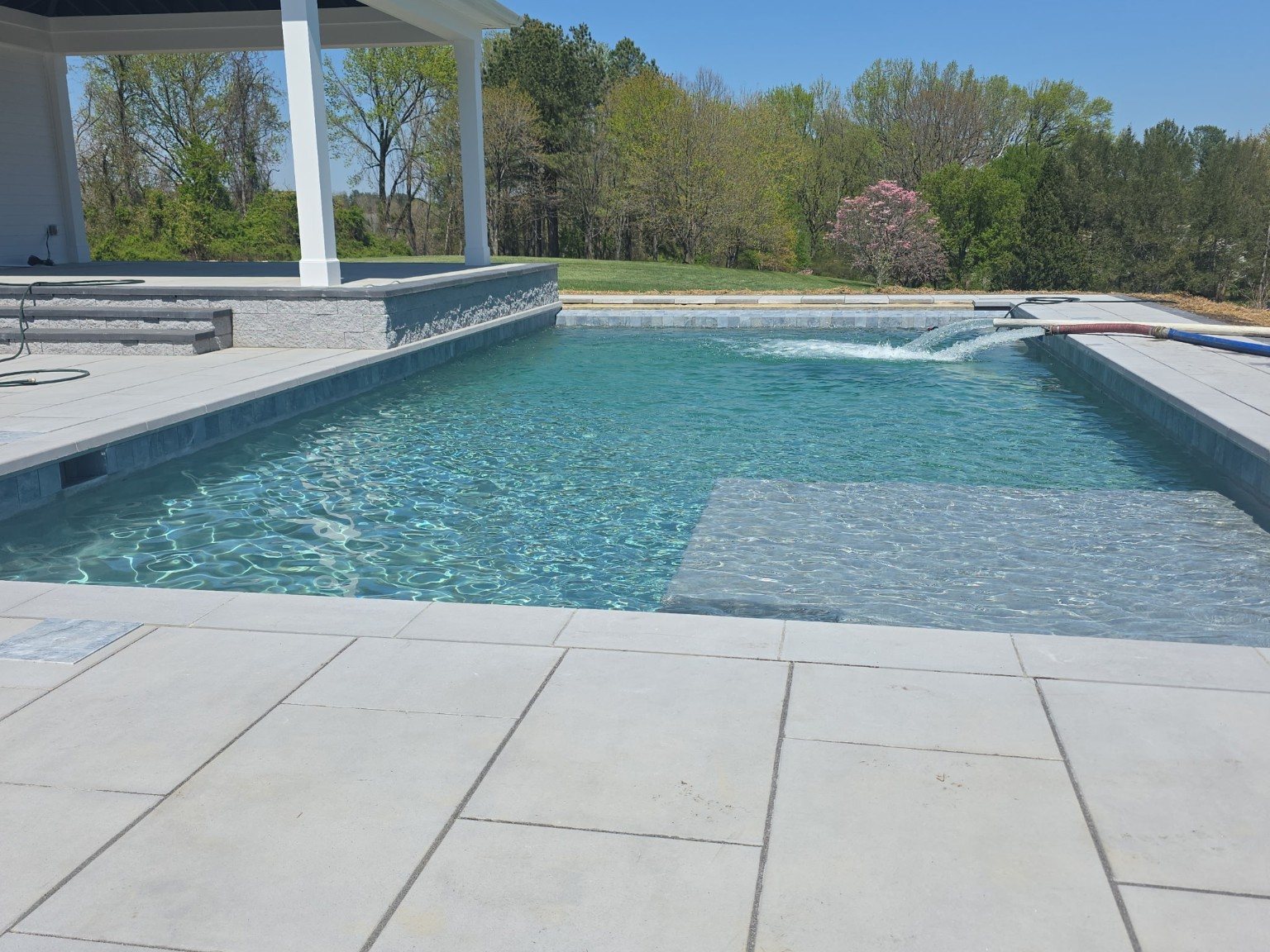 Pool with tanning ledge